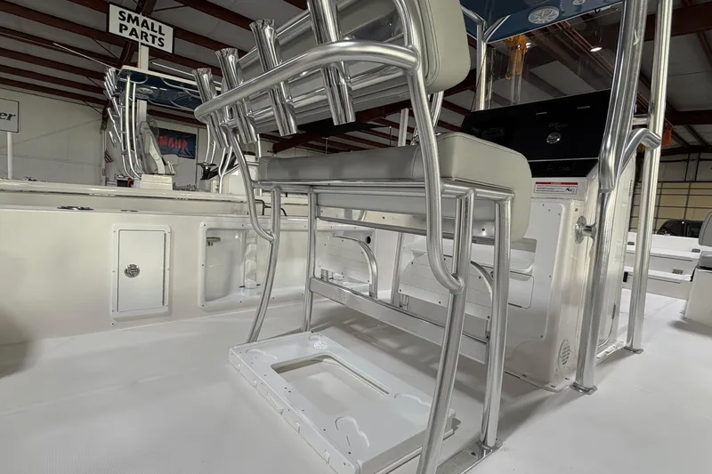 Slide: The Image of 2026 Bay Rider 2460 FS Skiff open storage compartment on deck, showcasing spacious design. - 12