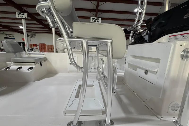 Slide: The Image of 2026 Bay Rider 2460 FS Skiff boat interior with open storage compartments. - 14