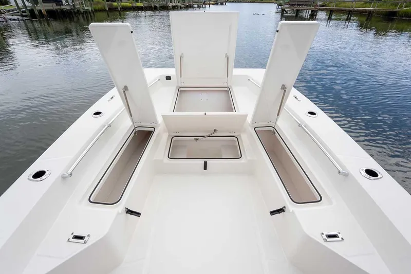 Slide: The Image of Livewell compartment on 2026 Bay Rider 2460 FS Skiff, featuring cushioned seating. - 20