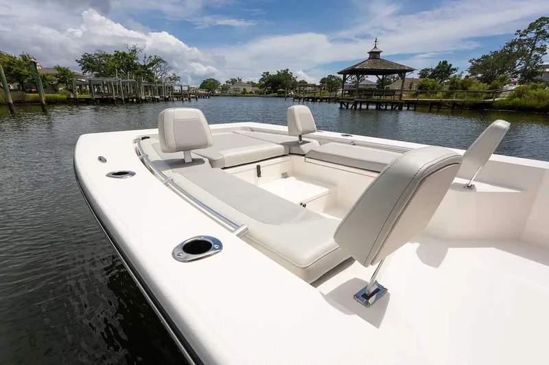 Slide: The Image of 2026 Bay Rider 2460 FS Skiff boat interior with seating and steering wheel. - 22