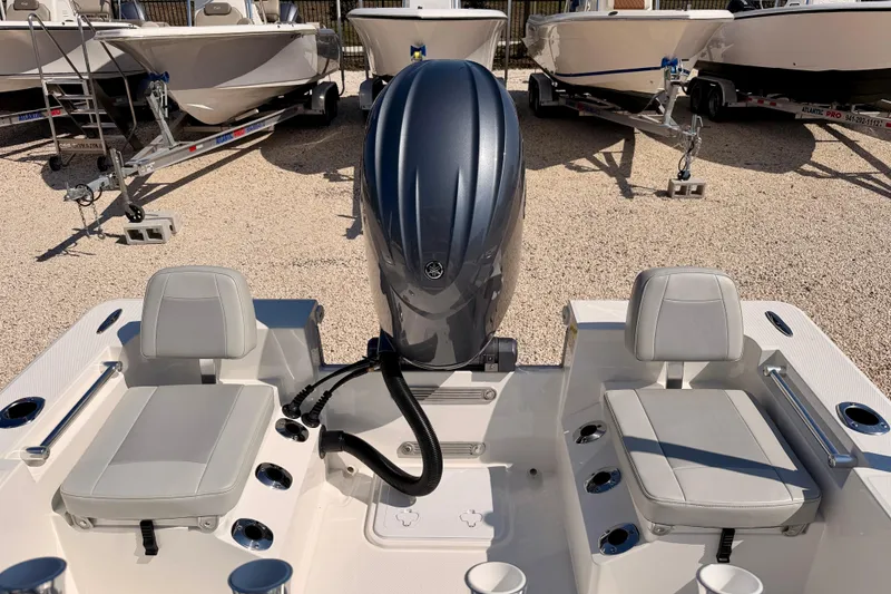 Slide: The Image of 2026 Bay Rider 2460 FS Skiff with dual seats and outboard motor. - 32