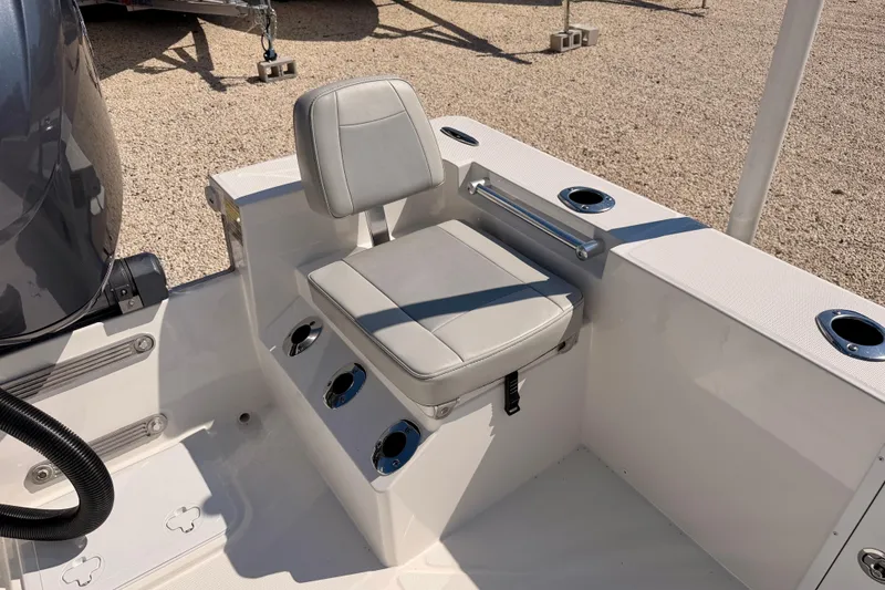 Slide: The Image of 2026 Bay Rider 2460 FS Skiff interior with cushioned seat and cup holders. - 33
