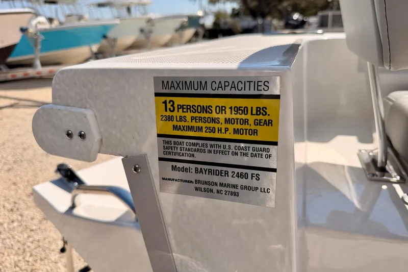 Slide: The Image of Bay Rider 2460 FS Skiff 2026 capacity label, 13 persons or 1950 lbs, 250 HP motor. - 39