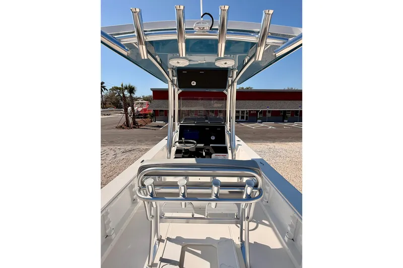 Slide: The Image of 2026 Bay Rider 2460 FS Skiff interior with steering console and rod holders. - 40