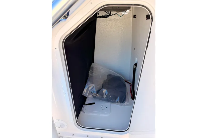 Slide: The Image of Storage compartment of 2026 Bay Rider 2460 FS Skiff, featuring interior details and wiring. - 47