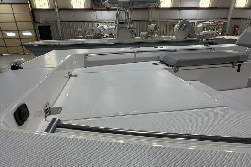 Slide: The Image of 2026 Bay Rider 2460 FS Skiff with Yamaha engine on trailer, parked outdoors. - 5