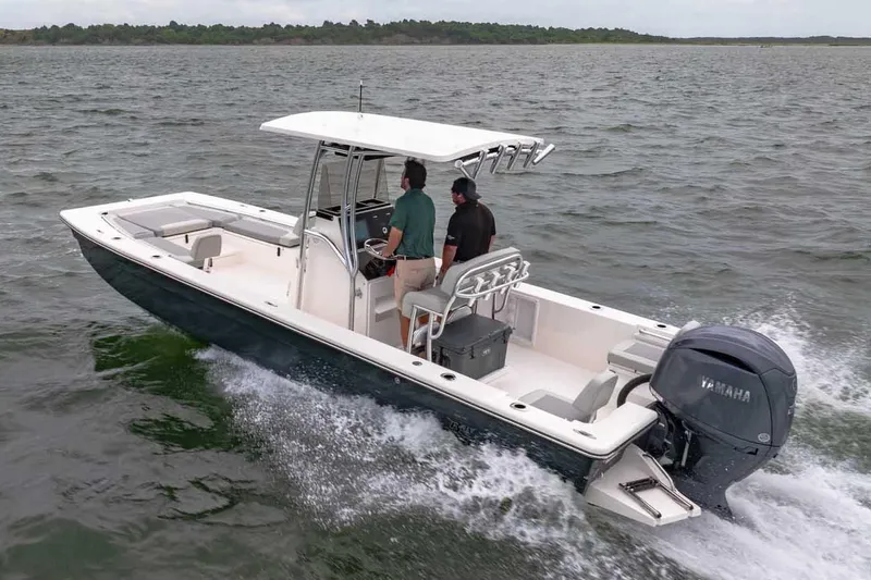 Slide: The Image of Manufacturer Provided Image: 2025 Bay Rider 2460 FS Skiff cruising on open water with two passengers. - 51