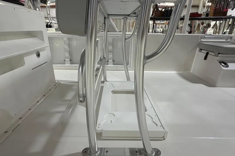 Slide: The Image of Bay Rider 2460 FS Skiff 2026 on trailer, underside view with chain reflection. - 9