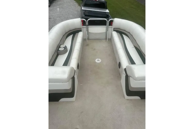 Slide: The Image of 2006 Avalon Paradise 24' pontoon boat interior with spacious seating and cup holders. - 4