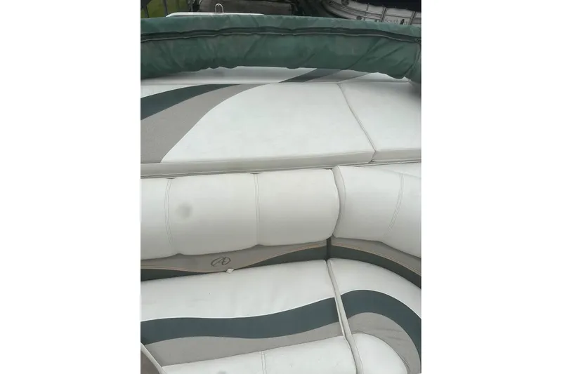 Slide: The Image of 2006 Avalon Paradise 24' boat interior with white and green seating. - 8