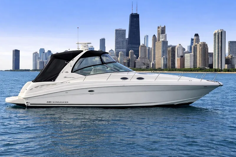 The Image of 2005 Sea Ray 340 Sundancer yacht on water with city skyline backdrop. - 0