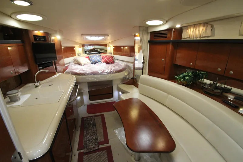 Slide: The Image of Luxurious interior of 2005 Sea Ray 340 Sundancer yacht with cozy seating and elegant wood finishes. - 9