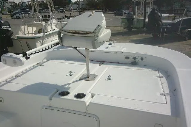 Slide: The Image of 2008 Carolina Skiff 218 DLV Elite boat deck with seating and storage compartments. - 15
