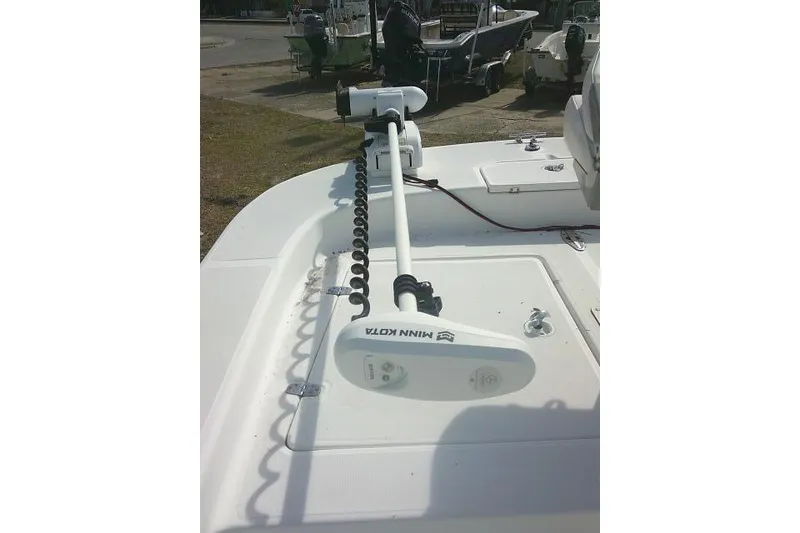 Slide: The Image of 2008 Carolina Skiff 218 DLV Elite with Minn Kota trolling motor on deck. - 16