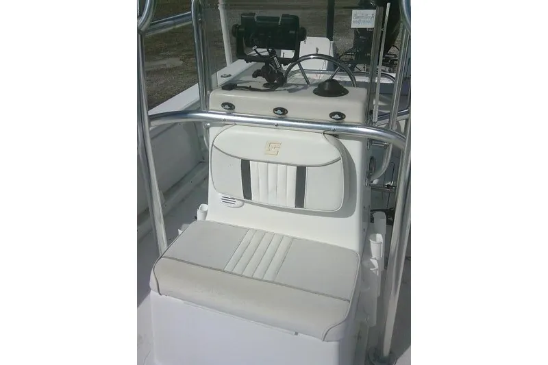 Slide: The Image of 2008 Carolina Skiff 218 DLV Elite boat console with seating and steering wheel. - 17
