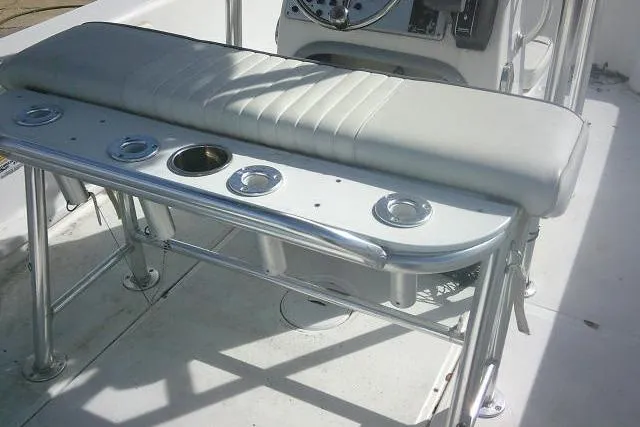 Slide: The Image of 2008 Carolina Skiff 218 DLV Elite boat interior with cushioned seating and rod holders. - 19