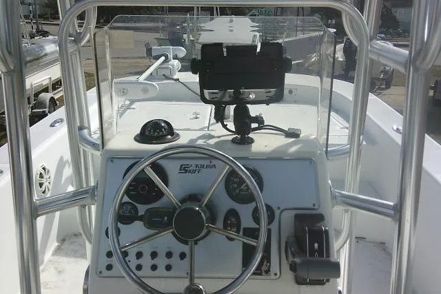 Slide: The Image of 2008 Carolina Skiff 218 DLV Elite boat console with steering wheel and controls. - 20