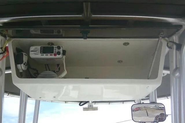 Slide: The Image of 2008 Carolina Skiff 218 DLV Elite boat console with radio equipment. - 21