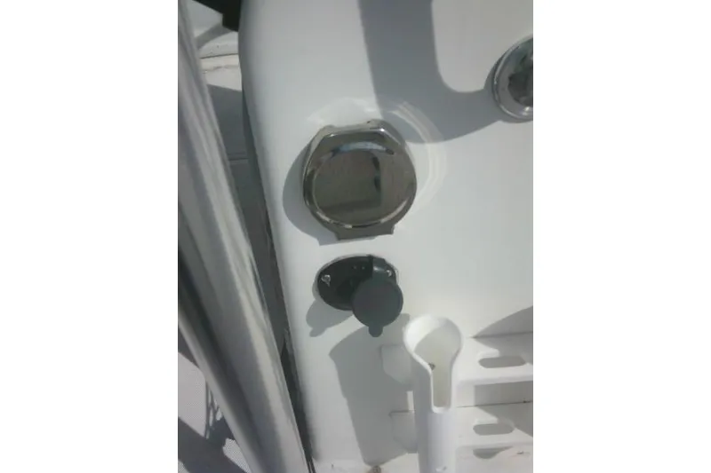 Slide: The Image of Close-up of 2008 Carolina Skiff 218 DLV Elite boat dashboard controls. - 22