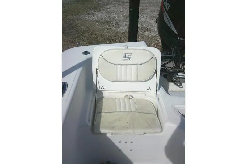 Slide: The Image of 2008 Carolina Skiff 218 DLV Elite boat seat with logo, white upholstery. - 23