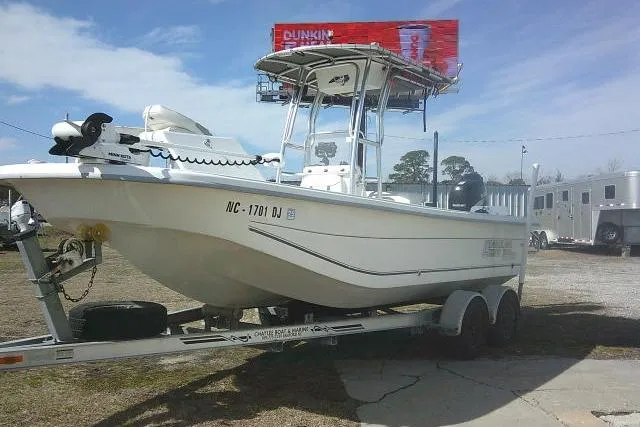 Slide: The Image of 2008 Carolina Skiff 218 DLV Elite boat on trailer, parked outdoors. - 5