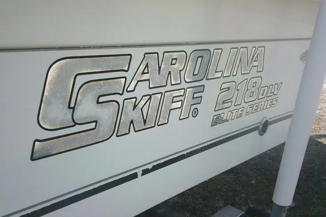 Slide: The Image of 2008 Carolina Skiff 218 DLV Elite boat logo on hull. - 7