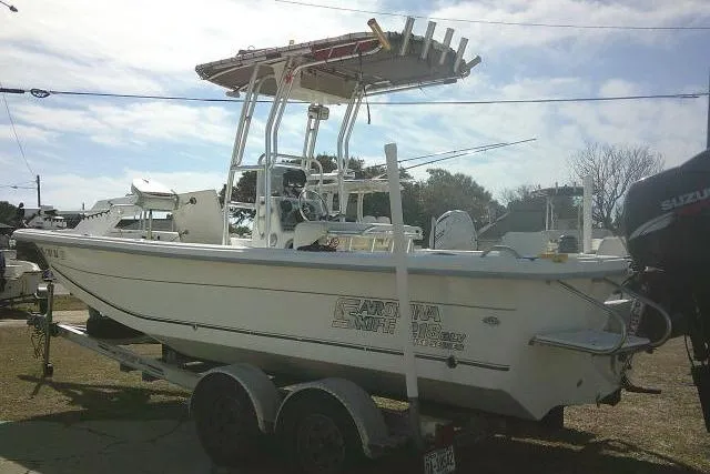 Slide: The Image of 2008 Carolina Skiff 218 DLV Elite boat on trailer, side view, outdoors. - 8