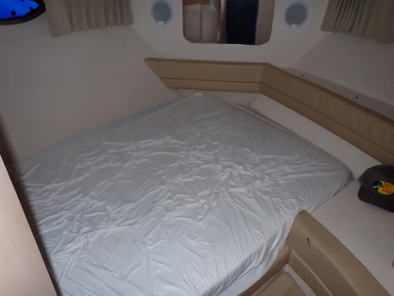 Slide: The Image of Interior of a 1997 Carver Voyager yacht with bed. - 8