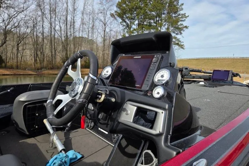 Slide: The Image of 2022 Nitro Z21 XL boat dashboard with steering wheel and electronic display. - 13