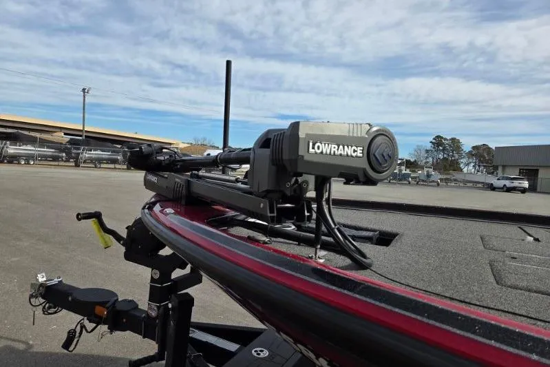 Slide: The Image of 2022 Nitro Z21 XL boat with Lowrance equipment, parked outdoors under a cloudy sky. - 8