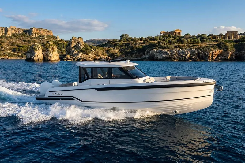 Slide: The Image of 2026 Wellcraft 28 Explorer cruising on scenic coastal waters. - 15