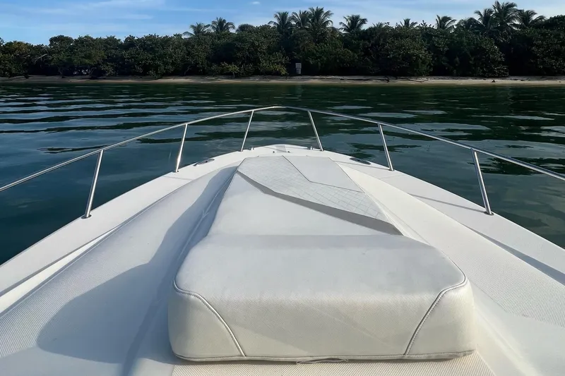 Slide: The Image of Open compartment of 2010 Triton 351 Express boat, showing interior details. - 10