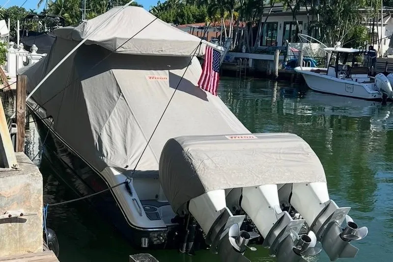 Slide: The Image of Open storage compartment on 2010 Triton 351 Express boat, showing interior details. - 9