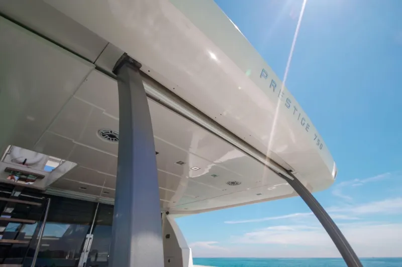 Slide: The Image of Luxury yacht Prestige 750, 2015 model, under clear blue sky. - 20