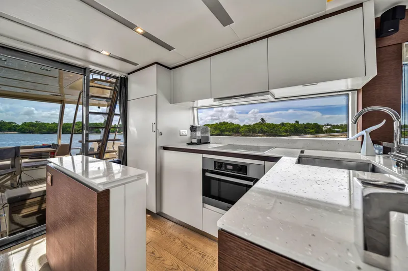 Slide: The Image of Modern kitchen interior on a 2015 Prestige 750 yacht, featuring sleek design and scenic views. - 37