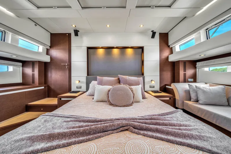 Slide: The Image of Luxurious interior of a 2015 Prestige 750 yacht with elegant bedding and modern design. - 40