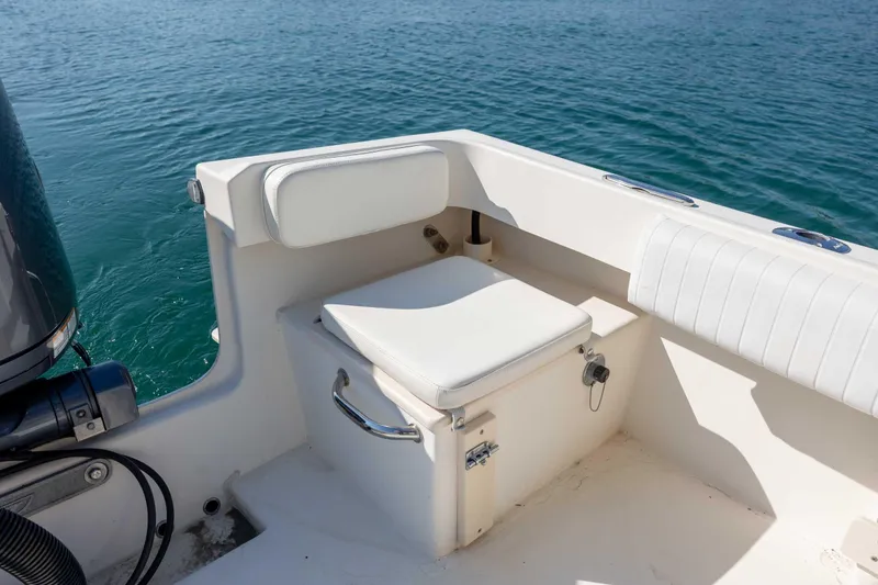 Slide: The Image of 2007 Parker 2300 Special Edition boat seat with storage, on calm blue water. - 12