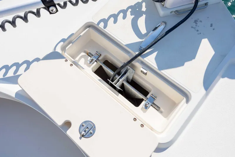 Slide: The Image of Anchor compartment on 2007 Parker 2300 Special Edition boat, featuring secure storage and cable management. - 19