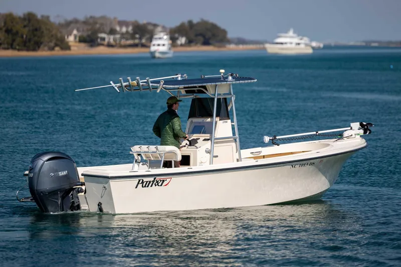 Slide: The Image of 2007 Parker 2300 Special Edition boat on calm water, featuring Yamaha outboard motor. - 4