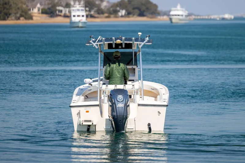 Slide: The Image of 2007 Parker 2300 Special Edition boat cruising on calm waters. - 6
