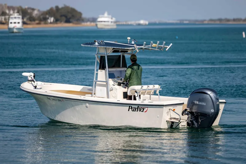 Slide: The Image of 2007 Parker 2300 Special Edition boat on calm water with Yamaha outboard motor. - 9