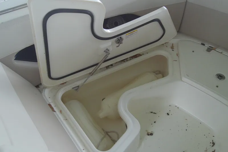Slide: The Image of Open storage compartment on 2021 Boston Whaler 280 Vantage boat, showing interior space. - 13
