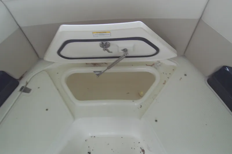 Slide: The Image of Open storage compartment on 2021 Boston Whaler 280 Vantage boat interior. - 14