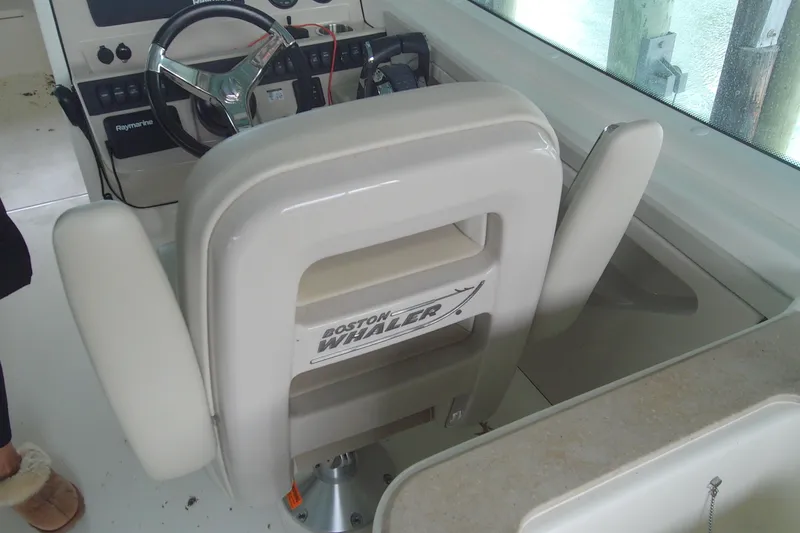 Slide: The Image of 2021 Boston Whaler 280 Vantage boat interior with steering wheel and seating. - 20