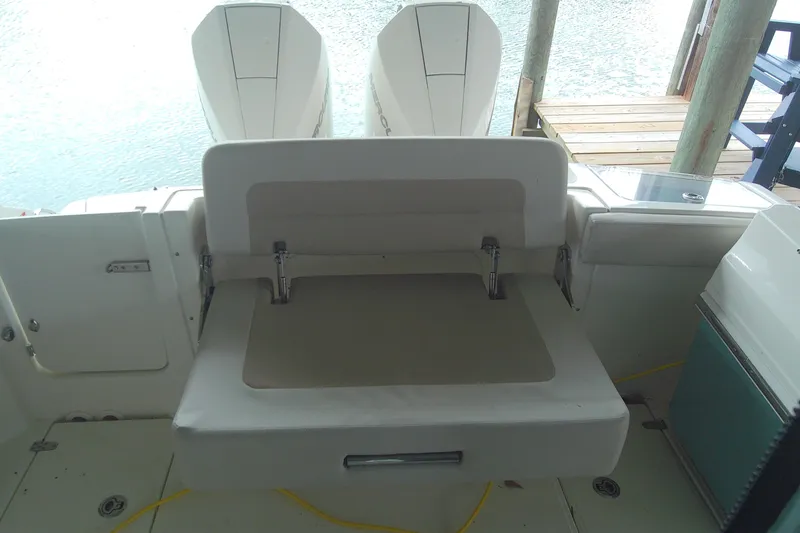 Slide: The Image of 2021 Boston Whaler 280 Vantage boat with foldable seating and dual engines. - 4