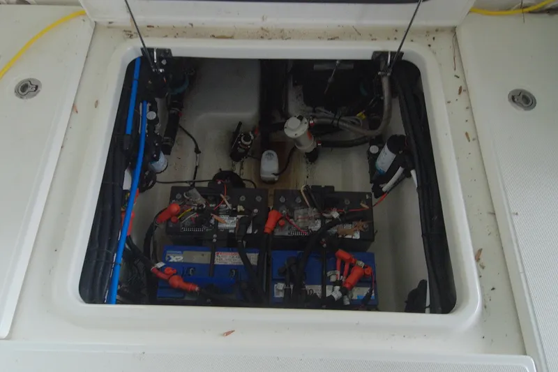 Slide: The Image of 2021 Boston Whaler 280 Vantage battery compartment with wiring and components. - 5