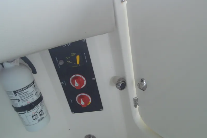 Slide: The Image of Fire extinguisher and control panel on 2021 Boston Whaler 280 Vantage boat. - 6