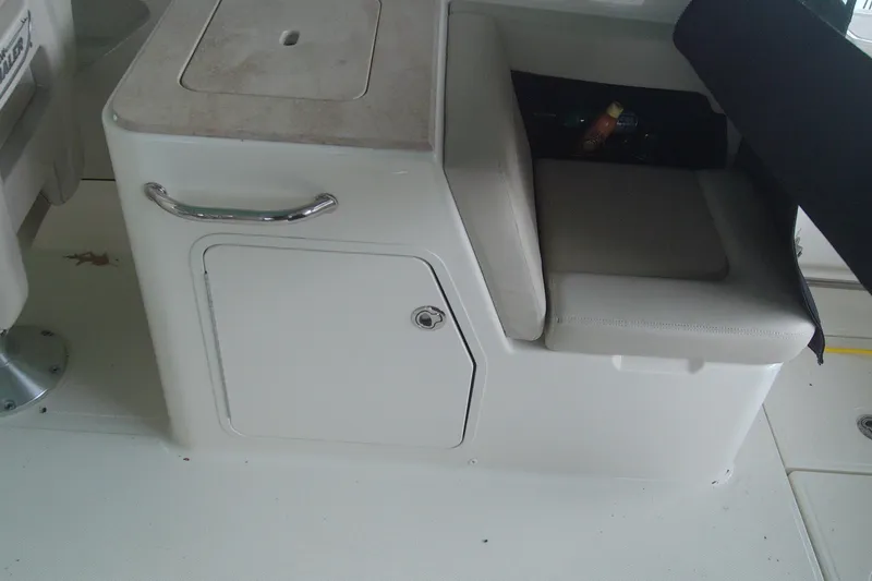Slide: The Image of 2021 Boston Whaler 280 Vantage interior seating and storage compartment. - 7