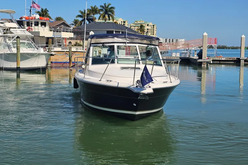 Slide: The Image of 2003 Tiara Yachts 2900 Coronet docked in Naples, Florida marina. - 12