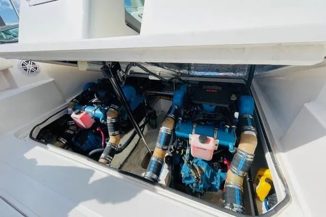 Slide: The Image of Engine compartment of 2003 Tiara Yachts 2900 Coronet, showcasing dual engines. - 25